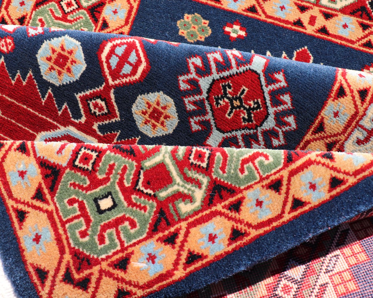 Tribal geometric medallion design vintage rug from Caucasus in multi - colors, Keivan Woven Arts / rug 10 - KE - 311, country of origin / type: Caucasus / Tribal, late 20th century Measures: 2'0 x 4'0 The vibrant reds, blues, and ivories that decorate ... - Keivan Woven Arts10 - KE - 311 - 1259Rug