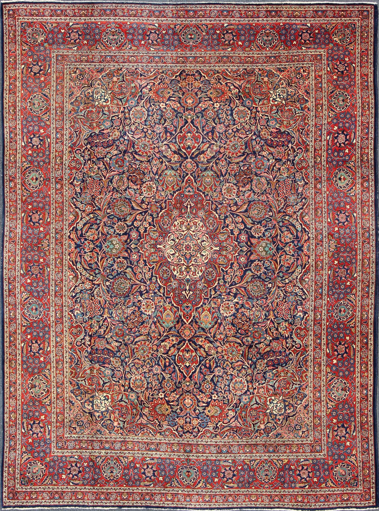 Fine Kashan Red and blue antique Persian Manchester Kashan rug with Arabesque blossom design, rug 11 - 90401, country of origin / type: Iran / Kashan, circa 1910 Gorgeous antique rug (circa 1910). Madder red and indigo blue set the attractive col... - Keivan Woven Arts11 - 90401 - 207Rug