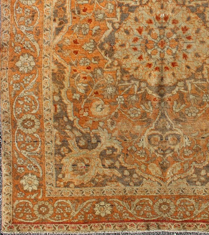 Antique Persian Tabriz Haji Jalili with Ornate Central Medallion and Florals in Orange, Brown Antique Persian Tabriz Haji Jalili with in Light Orange and light brown This magnificent antique Persian Tabriz carpet from late 19th century I... - Keivan Woven Arts16 - 1001 - 8131Rug