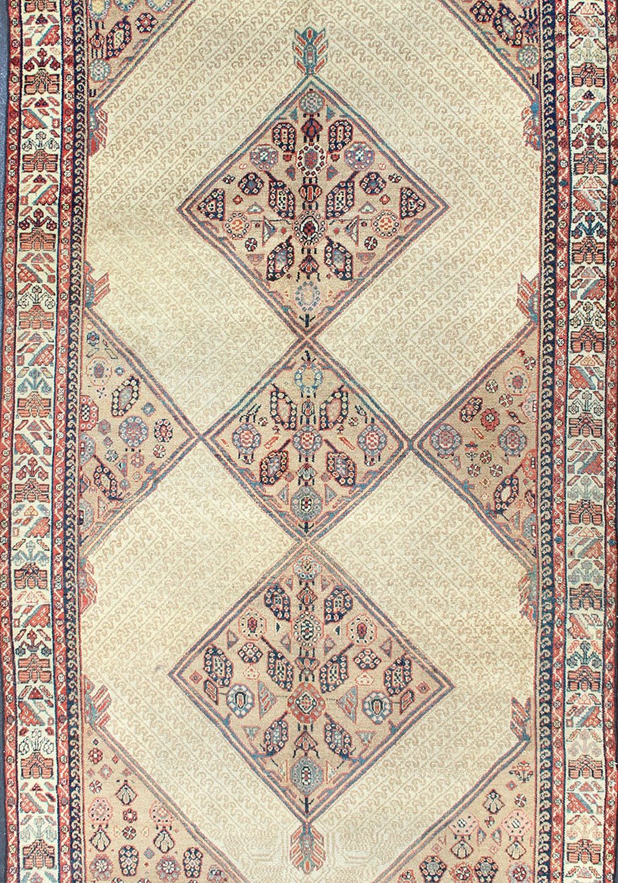 Antique Persian Serab Runner with Tribal Geometric Pattern in Camel, Red & Blue This beautiful antique late 19th Century Persian Serab runner rests on a camel background, which surrounds the three diamond medallions of alternating ivory, red, an... - Keivan Woven Arts16 - 1101 - 8211Rug