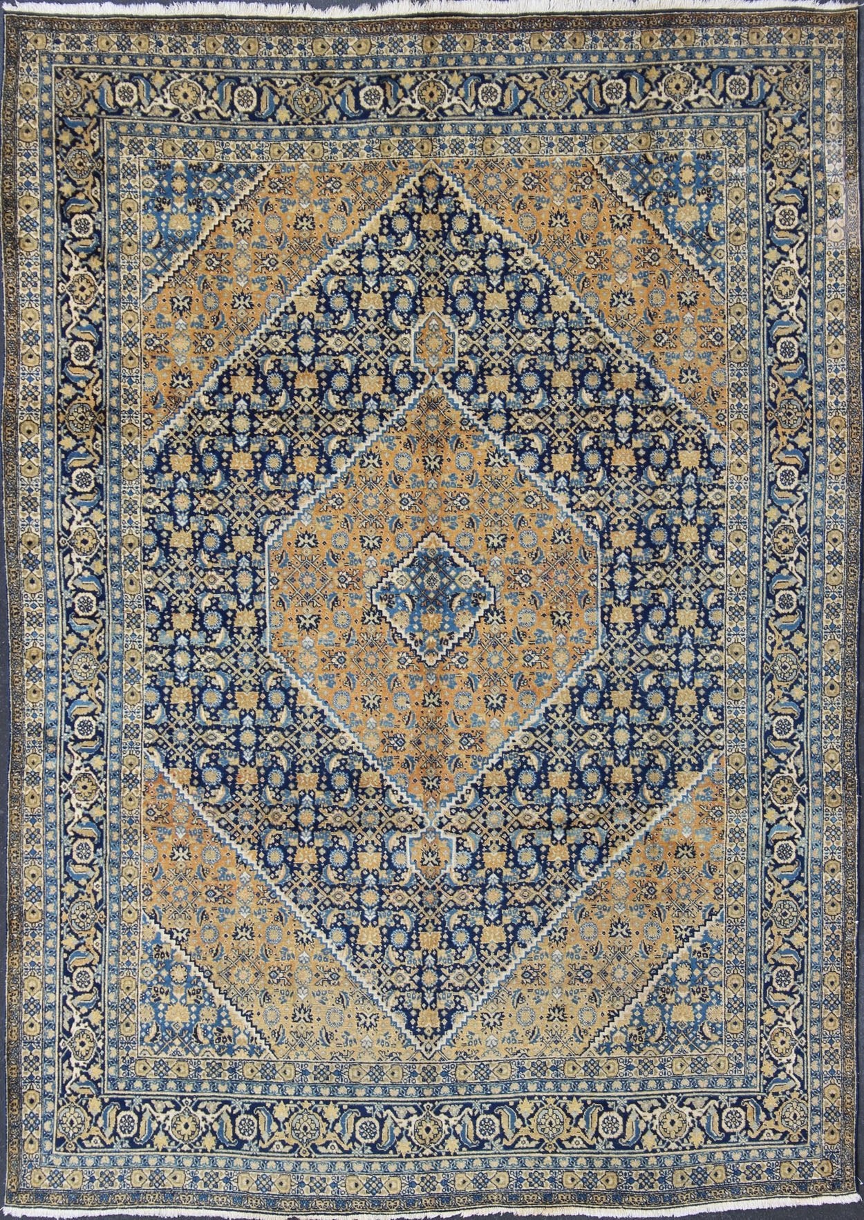 Antique Persian Tabriz Rug with Medallion And A Variety of Blue's and Gold's. Keivan Woven Arts / Rug / 16 - 1205, country of origin / type: Iran / Tabriz, circa 1920. Classic geometric Tabriz. Measures: 9'3 x 12'5. This antique Persian Tabriz rug ... - Keivan Woven Arts16 - 1205 - 8151Rug