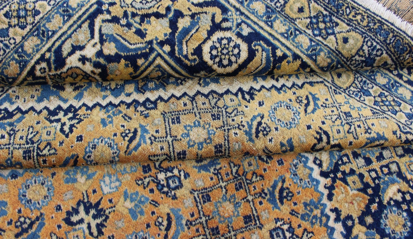 Antique Persian Tabriz Rug with Medallion And A Variety of Blue's and Gold's. Keivan Woven Arts / Rug / 16 - 1205, country of origin / type: Iran / Tabriz, circa 1920. Classic geometric Tabriz. Measures: 9'3 x 12'5. This antique Persian Tabriz rug ... - Keivan Woven Arts16 - 1205 - 8151Rug