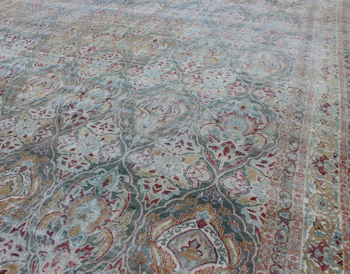 Very Large Antique Persian Distressed Lavar Kerman Rug In Large Scale Design. Very Large Antique finely woven Persian Lavar Kerman Rug In Large Scale Design. Large antique Persian Lavar Kerman distressed rug with large scale layered flowers in ... - Keivan Woven Arts17 - 1003 - 9232Rug