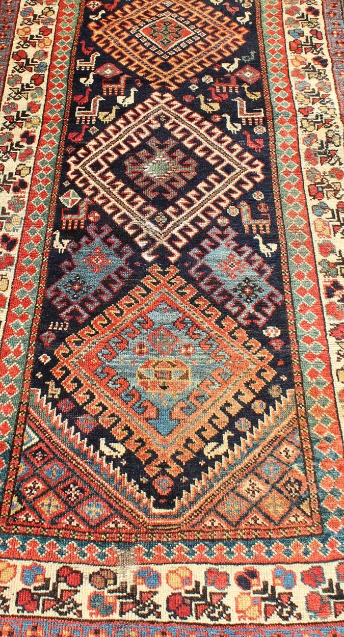 Qashqai Shiraz antique runner in multi - colors with multi - medallion geometric design. Keivan Woven Arts / rug 18 - 0406, country of origin / type: Iran / Shiraz, circa 1890. This antique Persian Shiraz rug features a unique blend of colors and an i... - Keivan Woven Arts18 - 0406 - 9388Rug