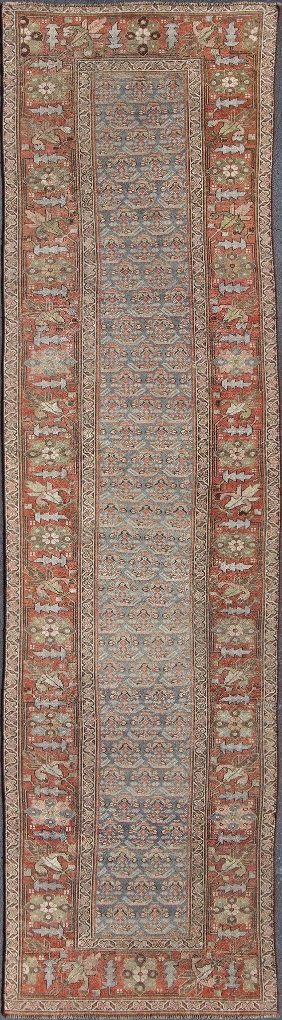 Gray background and soft red - colored Persian Kurdish antique runner in Tribal design with geometric motifs, rug 19 - 0105, country of origin / type: Iran / Kurdish, circa 1900. This antique Kurdish tribal rug was woven by Kurdish weavers in wester... - Keivan Woven Arts19 - 0105 - 11106Rug