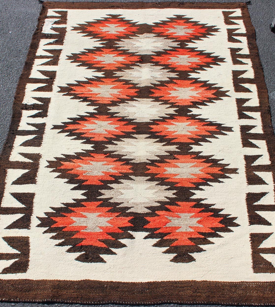 Vintage American Navajo Tribal Rug with Diamonds in Brown, Orange and Ivory This intriguing vintage Navajo rug was woven in the United States during the first half of the 20th century. The exciting and unique composition boasts a captivating geometr... - Keivan Woven Arts19 - 0203 - 11120Rug