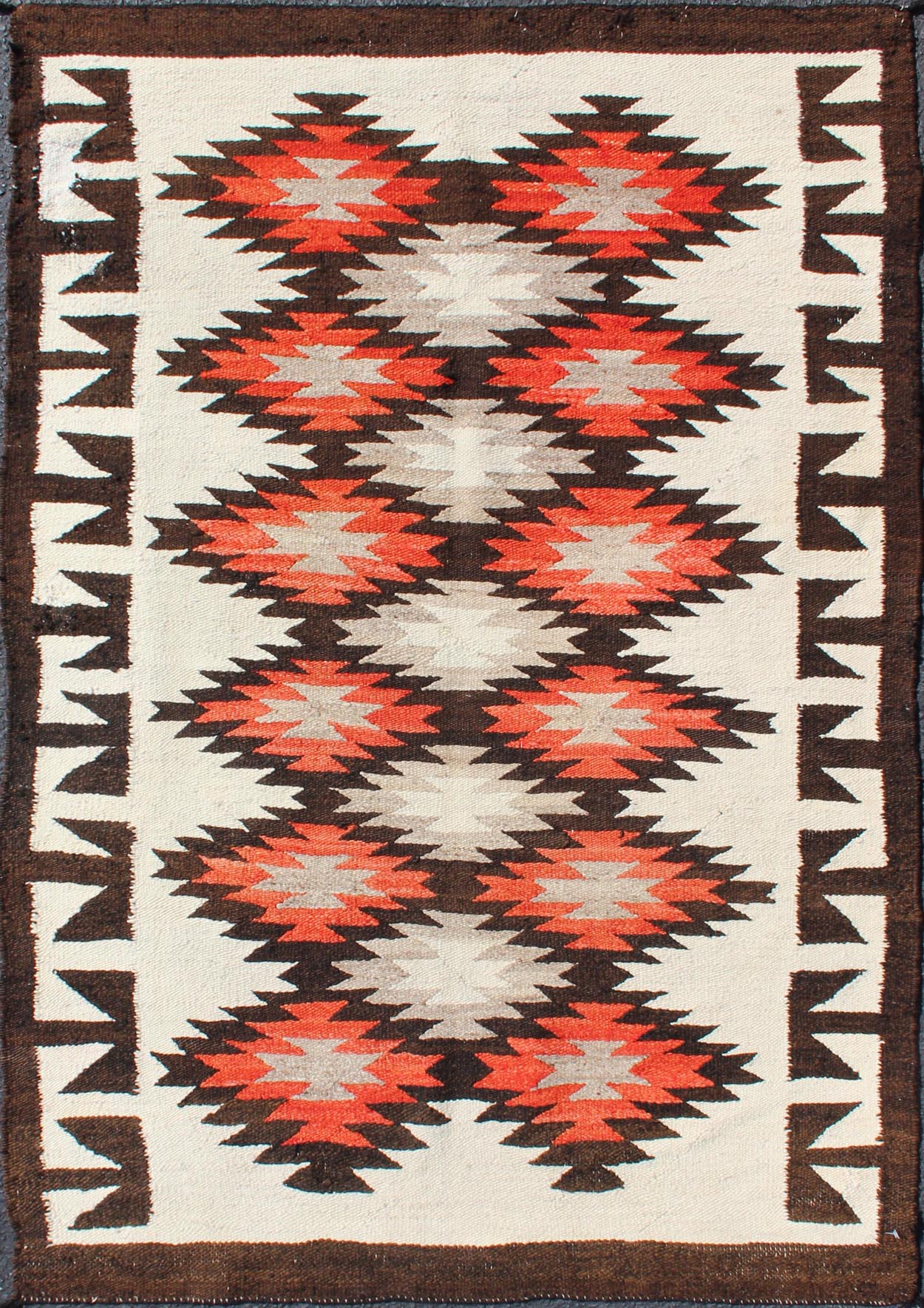Vintage American Navajo Tribal Rug with Diamonds in Brown, Orange and Ivory This intriguing vintage Navajo rug was woven in the United States during the first half of the 20th century. The exciting and unique composition boasts a captivating geometr... - Keivan Woven Arts19 - 0203 - 11120Rug