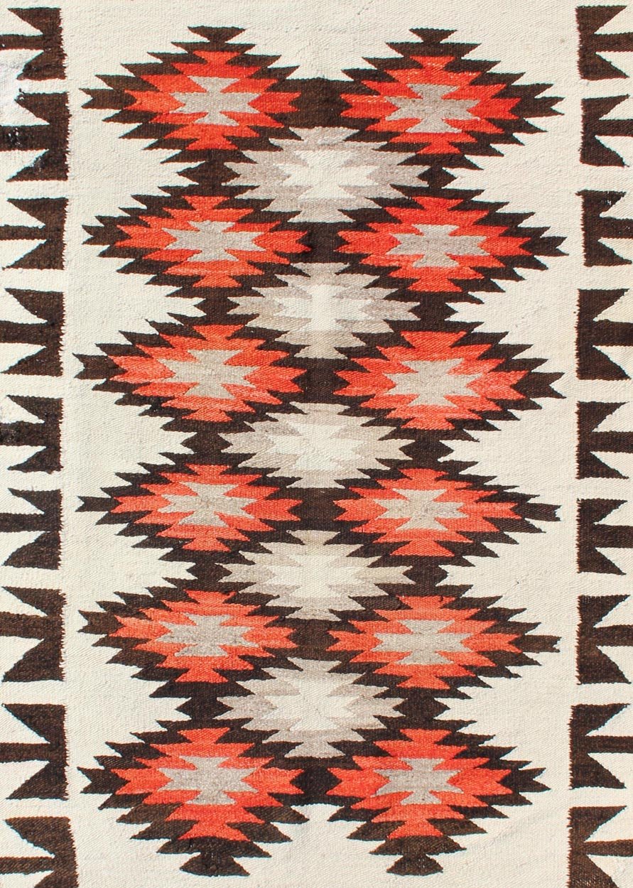 Vintage American Navajo Tribal Rug with Diamonds in Brown, Orange and Ivory This intriguing vintage Navajo rug was woven in the United States during the first half of the 20th century. The exciting and unique composition boasts a captivating geometr... - Keivan Woven Arts19 - 0203 - 11120Rug