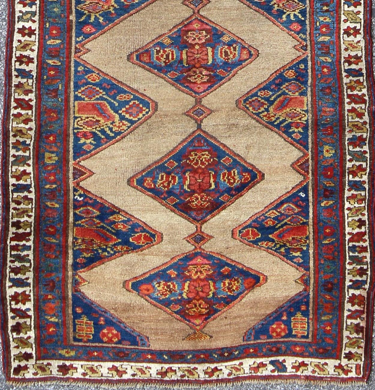 Colorful Long Antique Persian Serab Runner with Camel, Blue, Red and Brown The navy blue and camel field in this piece is decorated with multicolored strap work, lattice work and stylized Boteh and floral elements. Beautifully drawn ivory and bl... - Keivan Woven Arts20940 - 1438Rug