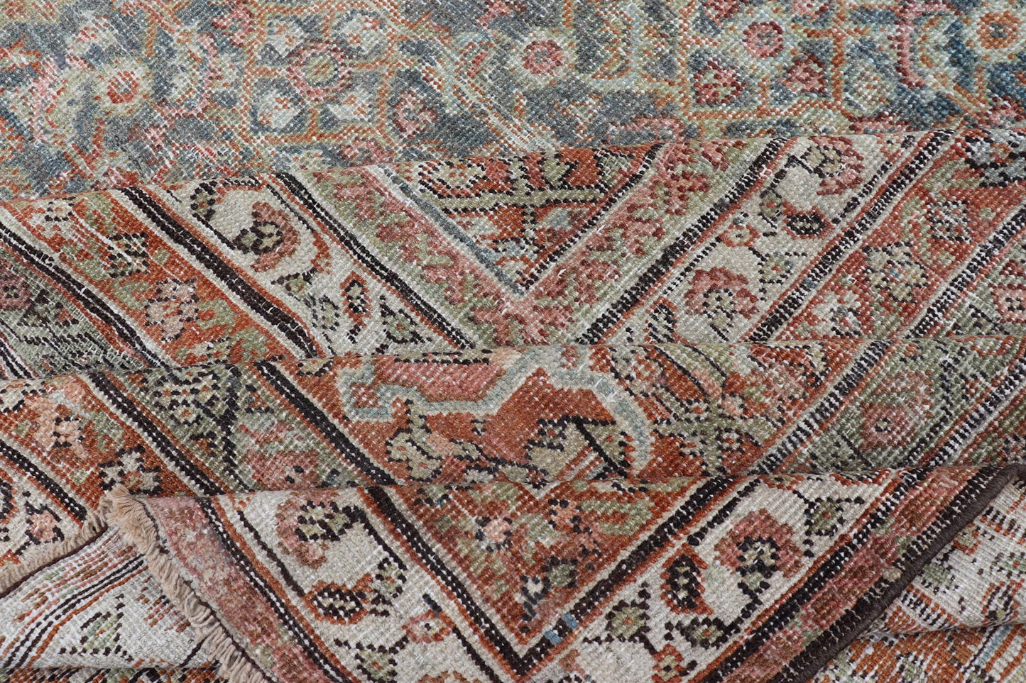 Antique Persian Distressed Sultanabad with All-Over Sub-Geometric Herati Design
This impressive antique distressed Persian Sultanabad rug features a superb all-over Herati and sub-geometric design throughout the entirety of the piece. The entir...