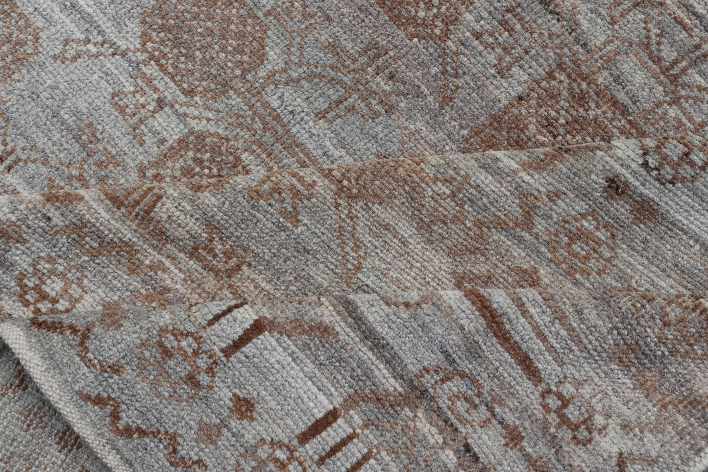 Modern Hand - Knotted Khotan Rug with Sub - Geometric Pomegranate Design This modern casual tribal rug has been hand - knotted. The rug features a modern sub - geometric pomegranate design and is enclosed within a complementary, multi - tiered border, re... - Keivan Woven ArtsAFG - 39680 - 19826Rug