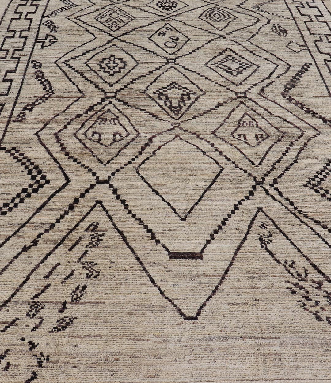 The design of the rug includes a series of interconnected diamond shapes, each containing different motifs such as crosses, zigzags, and other stylized symbols. The central theme is a grid of diamond patterns that vary slightly in size and detail, crea... - Keivan Woven ArtsAFG - 39925 - 19598Rug