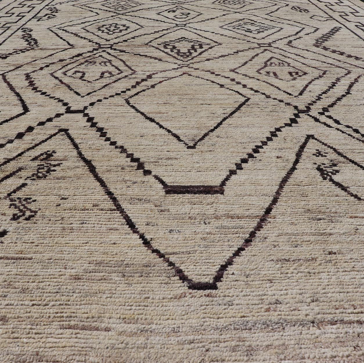 The design of the rug includes a series of interconnected diamond shapes, each containing different motifs such as crosses, zigzags, and other stylized symbols. The central theme is a grid of diamond patterns that vary slightly in size and detail, crea... - Keivan Woven ArtsAFG - 39925 - 19598Rug