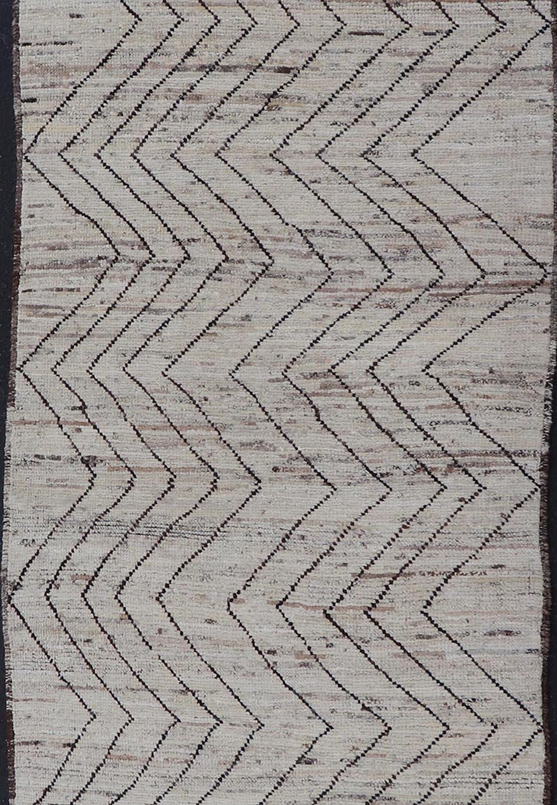 Modern Hand - Knotted Runner in Wool with Sub - Geometric Zig - Zag Design This modern casual runner has been hand - knotted. The rug features a modern sub - geometric zig - zag design, rendered in black and earthy tones, making this rug a superb fit for a... - Keivan Woven ArtsAFG - 39950 - 19238Rug