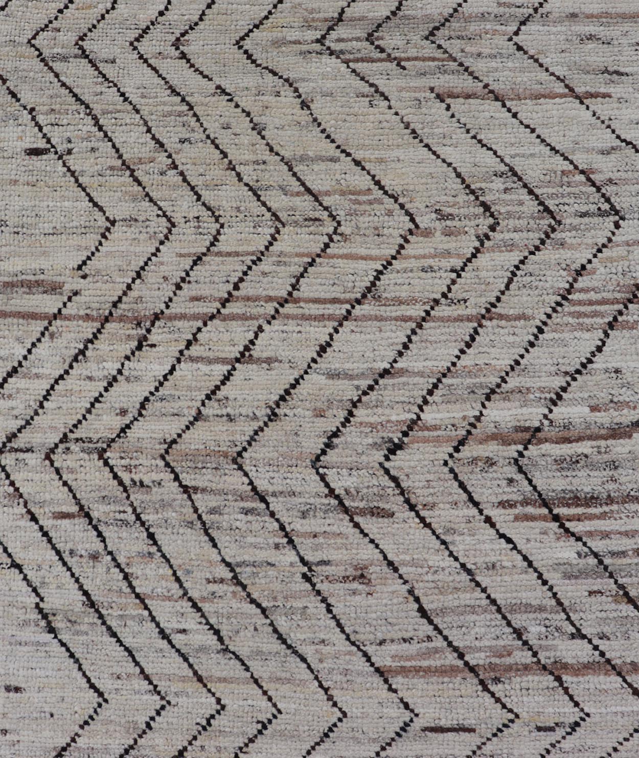Modern Hand - Knotted Runner in Wool with Sub - Geometric Zig - Zag Design This modern casual runner has been hand - knotted. The rug features a modern sub - geometric zig - zag design, rendered in black and earthy tones, making this rug a superb fit for a... - Keivan Woven ArtsAFG - 39950 - 19238Rug