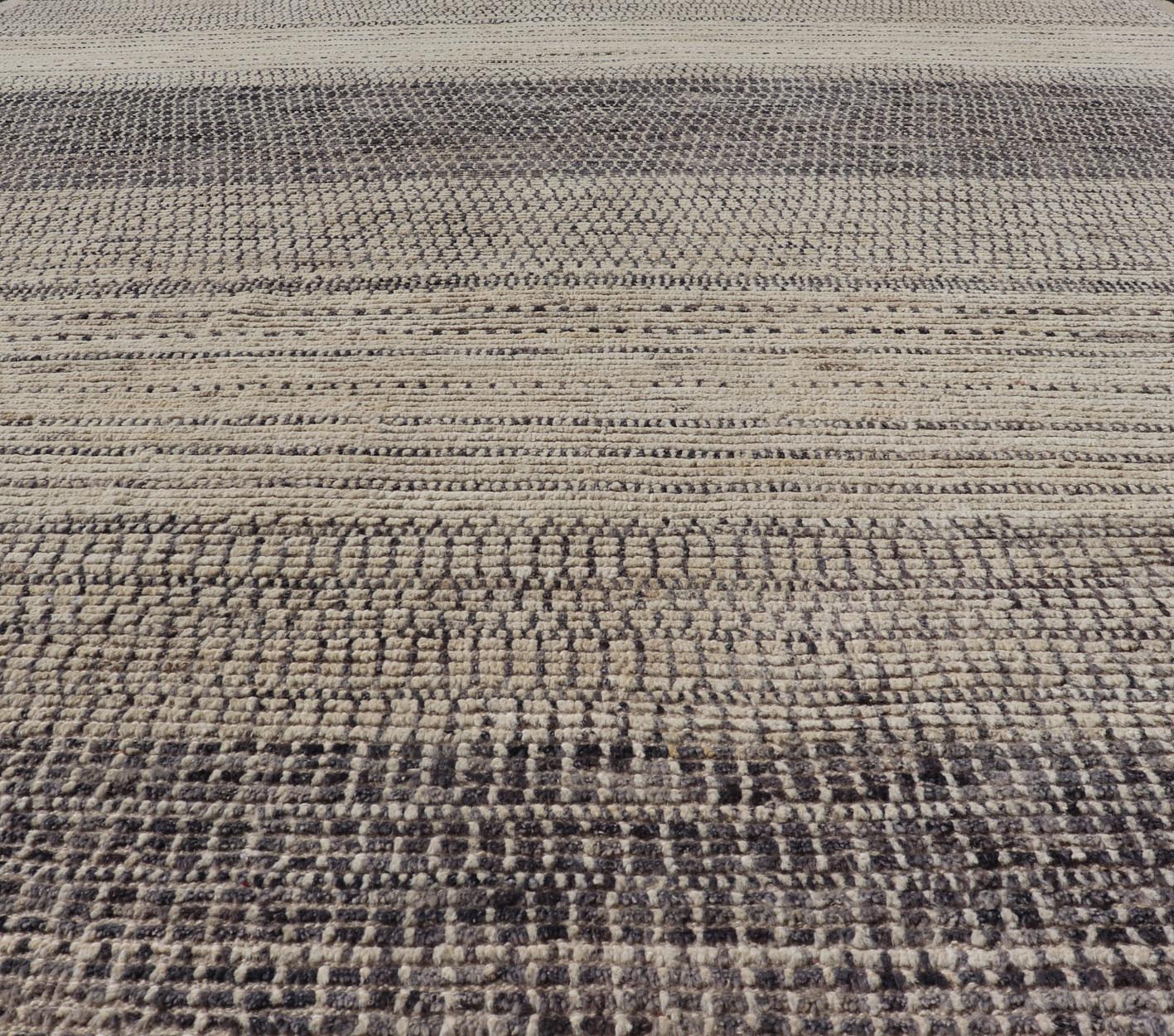 This modern casual tribal rug has been hand - knotted in wool. The rug features an all - over modern sub - geometric horizontal design, rendered in grays, brown, cream and neutral tones. Measures: 9'5 x 12'1. Modern casual tribal rug with sub - geometric... - Keivan Woven ArtsAFG - 40922 - 19622Rug