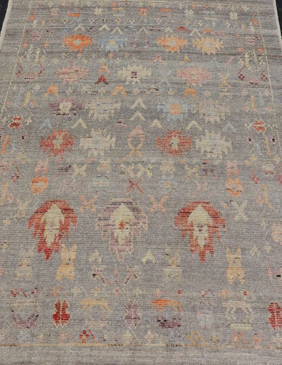 Modern Casual Afghan Hand - Knotted Wool Rug in Taupe Measures: 4'5 x 6'3 This charismatic piece holds much personality in the all - over design of motifs. The tribal - like motifs are rendered in red, beige, pink, blue and small accents of ap... - Keivan Woven ArtsAFG - 43425 - 20253Rug