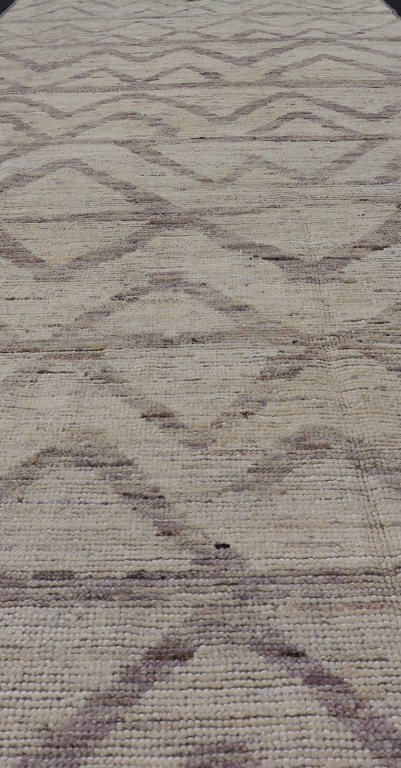 Afghan Modern Casual Chevron Runner in Light Cream and Dark Gray This quirky gallery runner features cream and light gray, with a chevron - like pattern skewing across the rug's width. Between the quiet coalescence of the shades of gray an... - Keivan Woven ArtsAFG - 43428 - 20181Rug