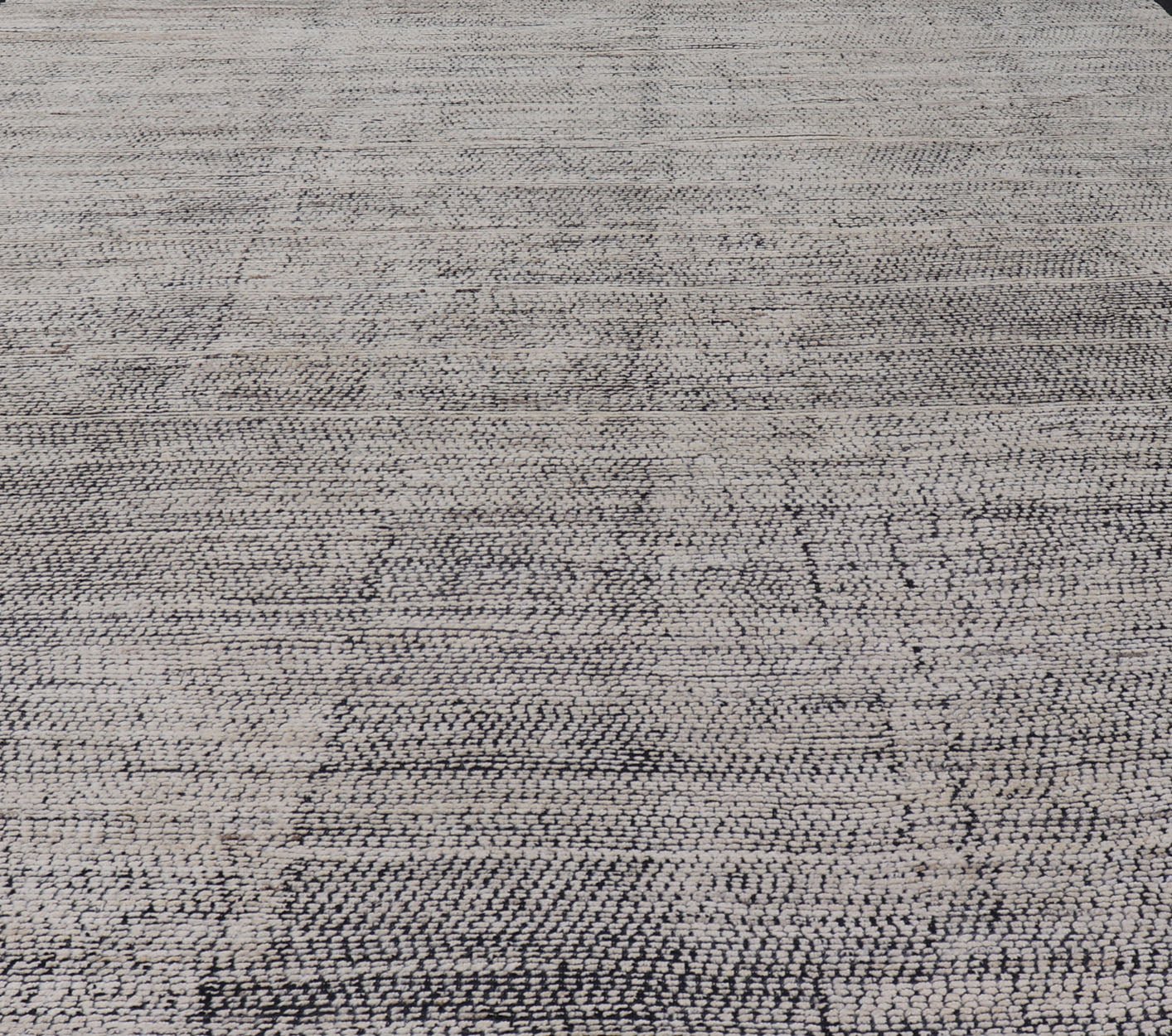 Oversized Afghan Minimalist Modern Casual With Black Background and Ivory Pile This large modern casual rug's field displays a ivory colored pile. Underneath the field shows a black base for a background. These beautiful colors are perfect for ... - Keivan Woven ArtsAFG - 43429 - 20187Rug