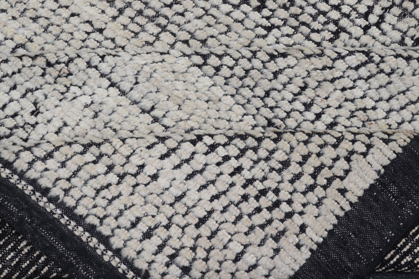 Oversized Afghan Minimalist Modern Casual With Black Background and Ivory Pile This large modern casual rug's field displays a ivory colored pile. Underneath the field shows a black base for a background. These beautiful colors are perfect for ... - Keivan Woven ArtsAFG - 43429 - 20187Rug