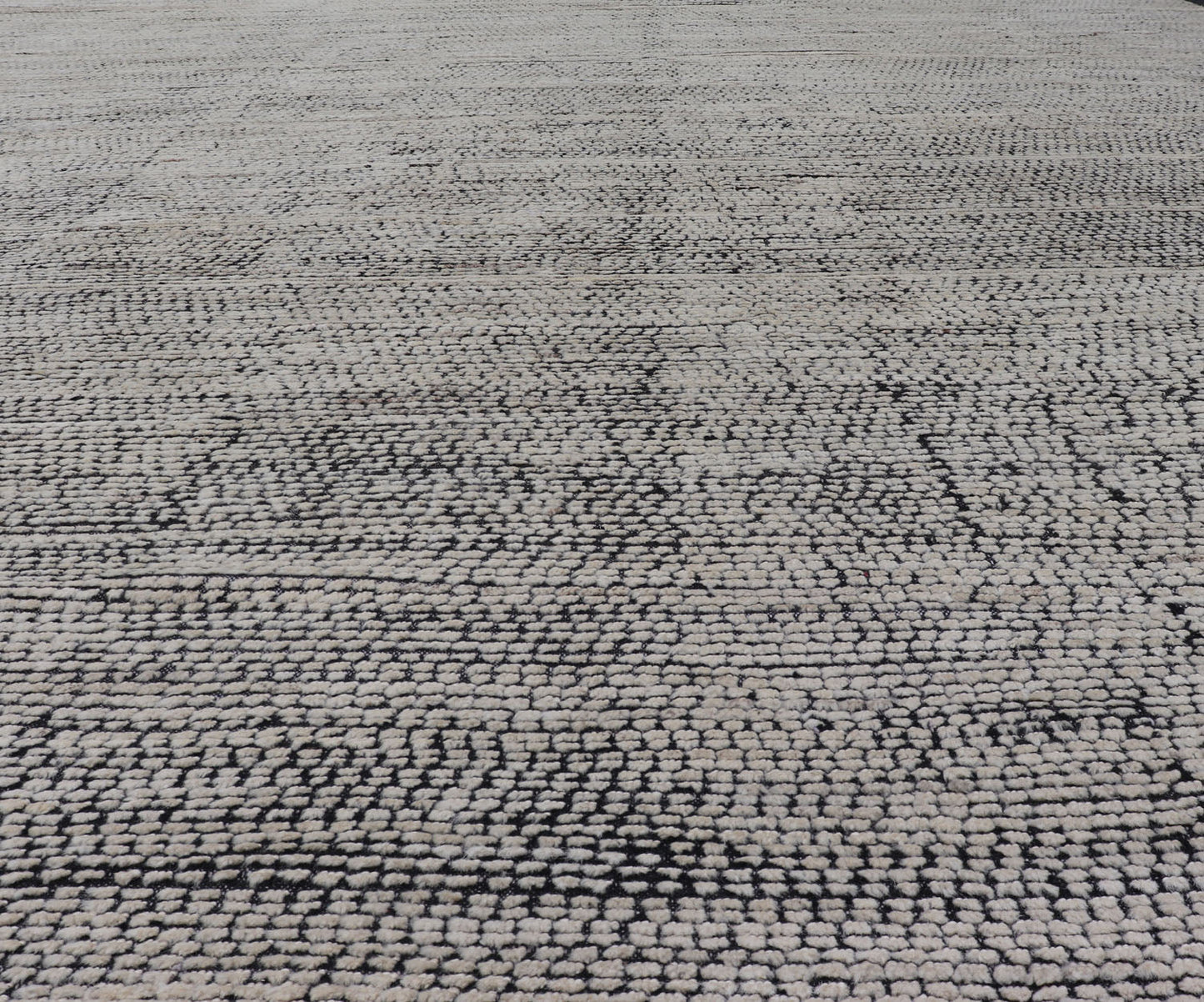Oversized Afghan Minimalist Modern Casual With Black Background and Ivory Pile This large modern casual rug's field displays a ivory colored pile. Underneath the field shows a black base for a background. These beautiful colors are perfect for ... - Keivan Woven ArtsAFG - 43429 - 20187Rug