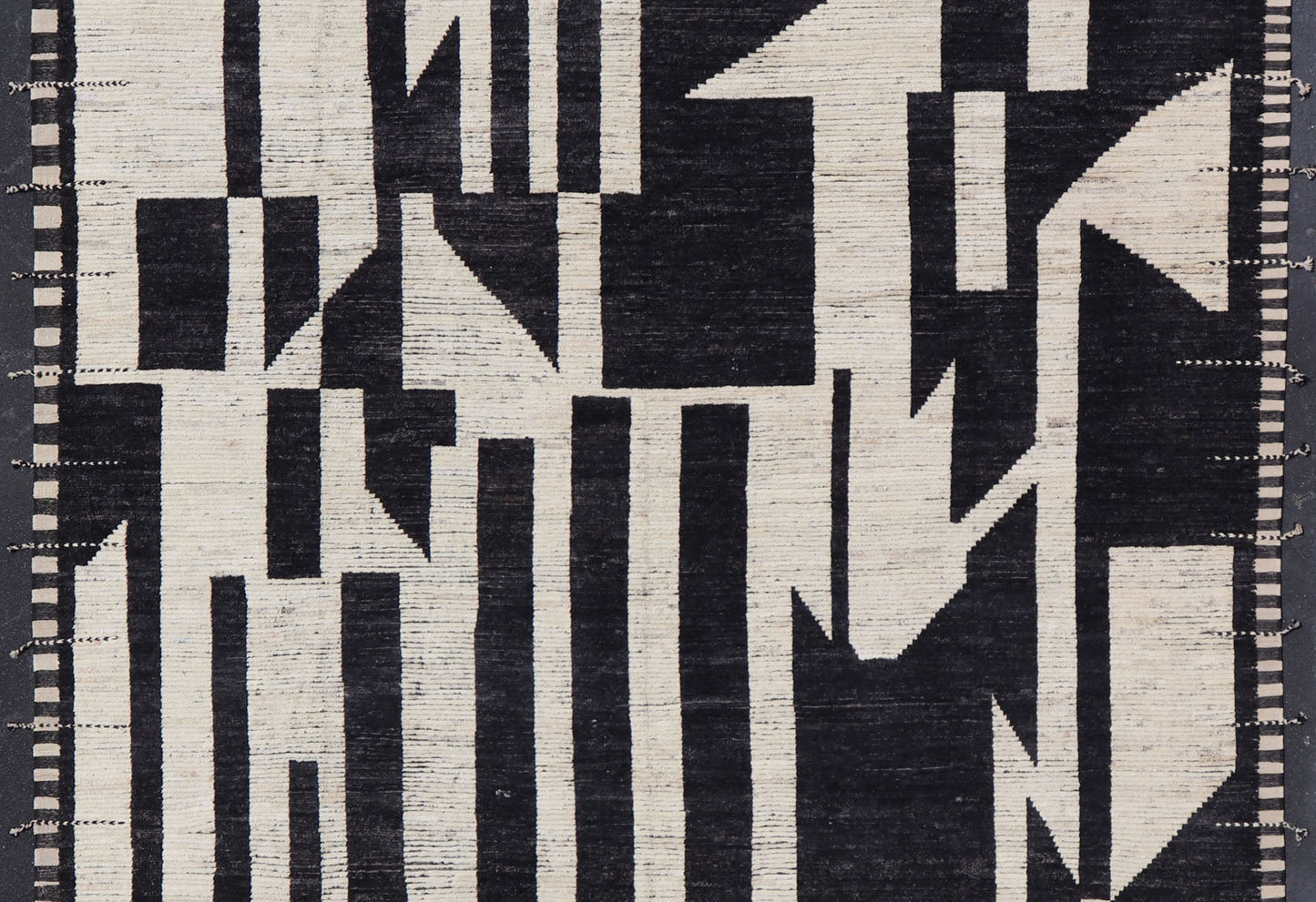 Ebony and Ivory Oversized Abstract Modern Casual This oversized modern casual was hand - knotted in Afghanistan. The field portrays an ivory background disrupted by flashes of ebony abstractions. The small simple border has a crafty ivory embr... - Keivan Woven ArtsAFG - 43436 - 20247Rug