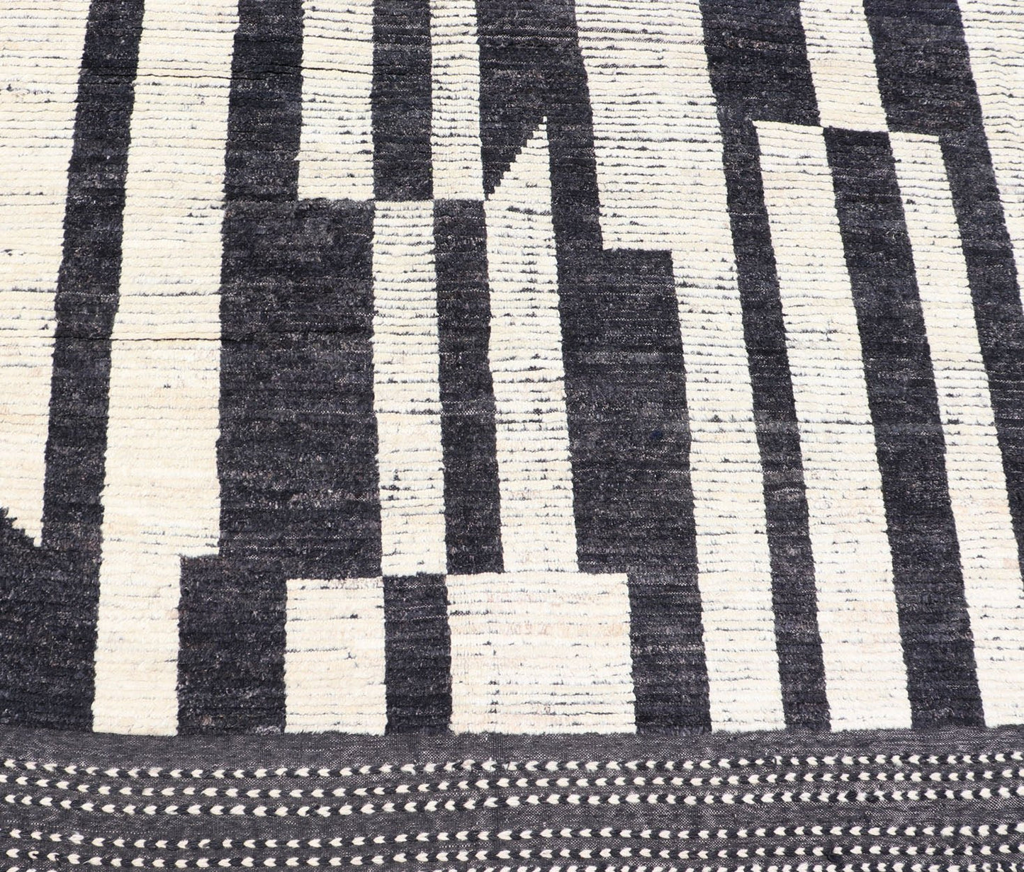 Ebony and Ivory Oversized Abstract Modern Casual This oversized modern casual was hand - knotted in Afghanistan. The field portrays an ivory background disrupted by flashes of ebony abstractions. The small simple border has a crafty ivory embr... - Keivan Woven ArtsAFG - 43436 - 20247Rug
