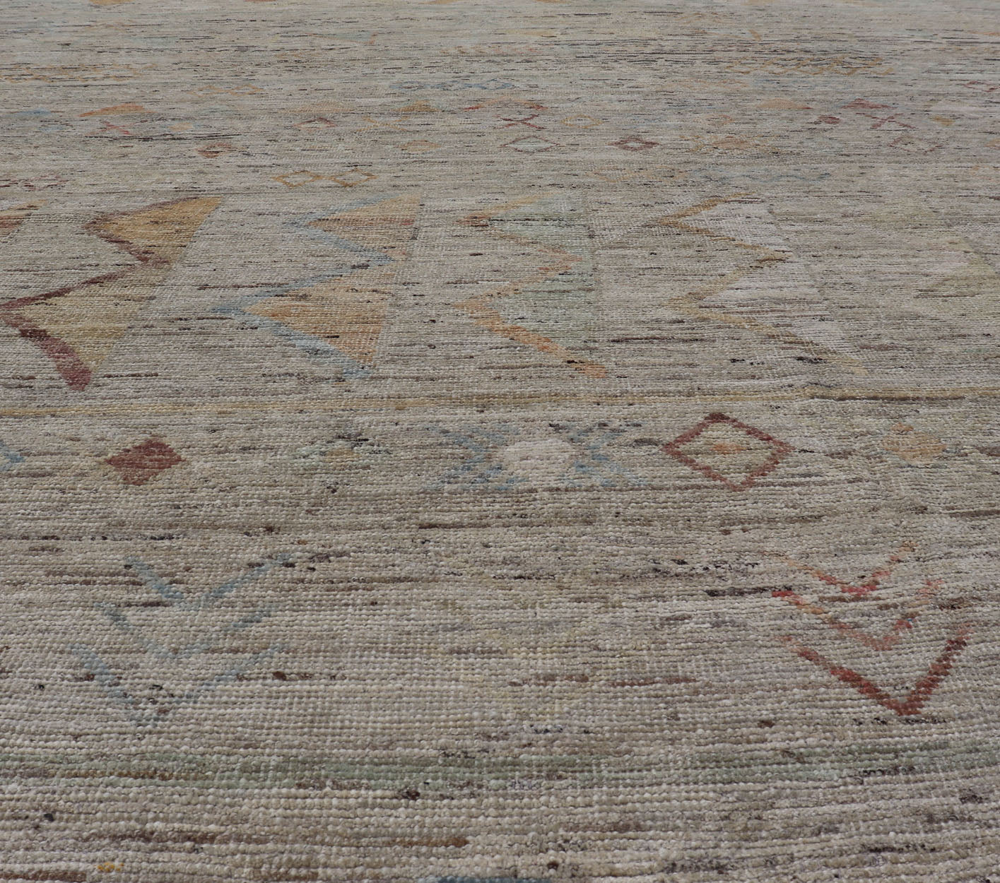 Large Modern Casual Area Rug in Sandy Tones With Pops of Color This elegant modern casual was hand - knotted in Afghanistan. The large open field displays tribal - like motifs atop of warm - yet - subtle sandy hues of beige and light taupe. The des... - Keivan Woven ArtsAFG - 43448 - 20217Rug