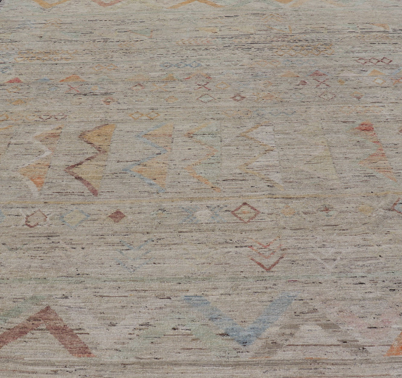 Large Modern Casual Area Rug in Sandy Tones With Pops of Color This elegant modern casual was hand - knotted in Afghanistan. The large open field displays tribal - like motifs atop of warm - yet - subtle sandy hues of beige and light taupe. The des... - Keivan Woven ArtsAFG - 43448 - 20217Rug