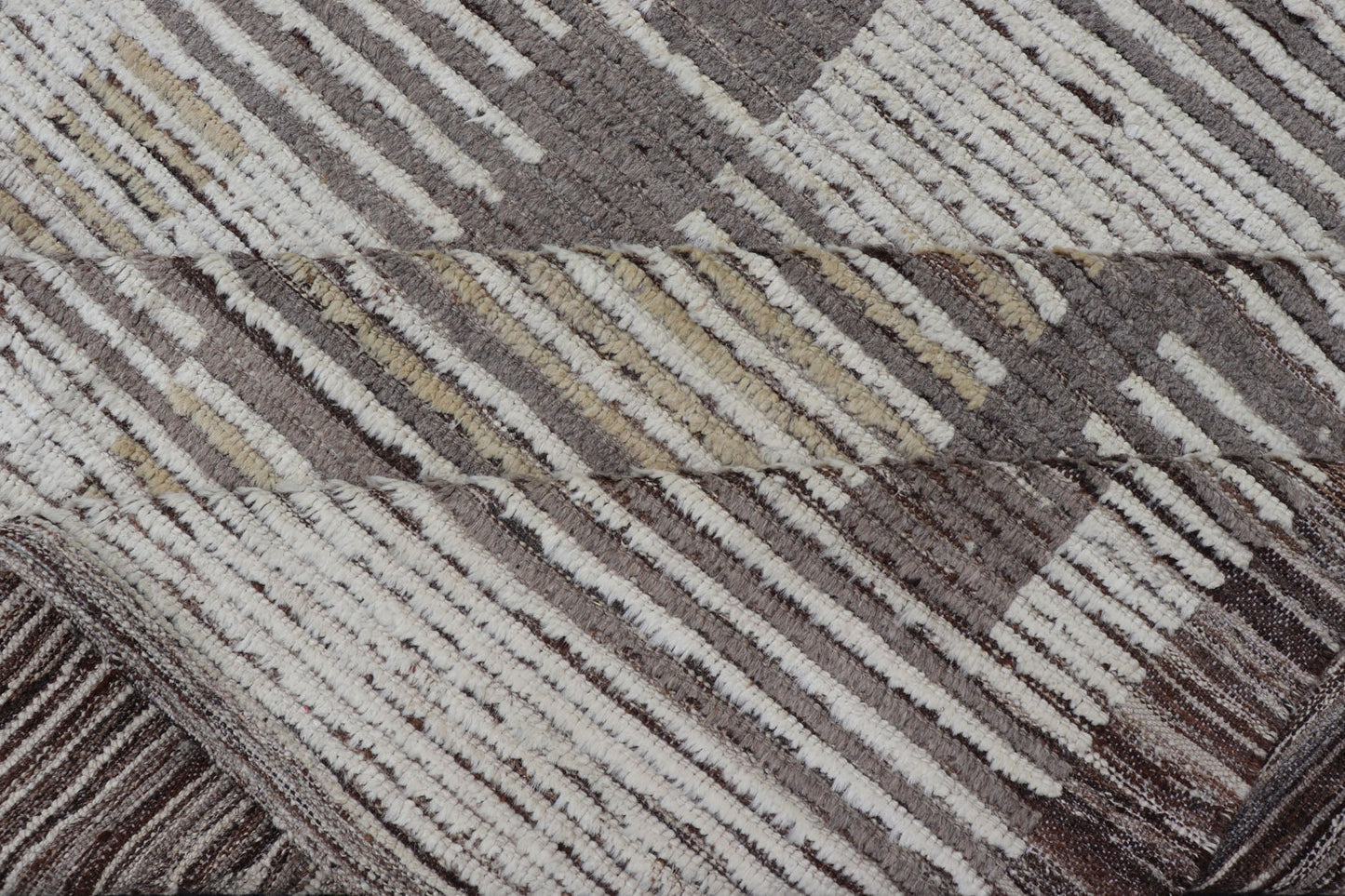 Oversized Afghan Modern Casual Abstract Rug in Muted Earthy Tones This large modern casual features earthy tones, starting with a homogeneous ivory background, with panes of horizontal stripes of taupe. The field features an abstract fo... - Keivan Woven ArtsAFGC - 43431 - 20163Rug