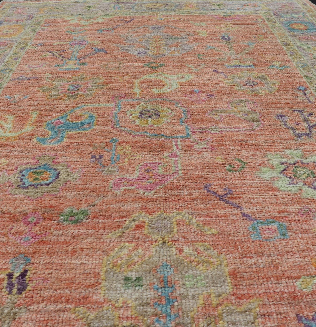 Hand Knotted Turkish Floral Oushak with Orange Background and Lilac Border This very unique piece has a wide array of bright colors, starting with a faded orange background and a light lilac border, showcasing fuchsia, electric blue, violet, or... - Keivan Woven ArtsAN - 149896 - 19941Rug