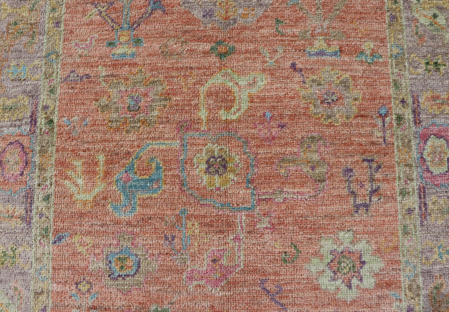 Hand Knotted Turkish Floral Oushak with Orange Background and Lilac Border This very unique piece has a wide array of bright colors, starting with a faded orange background and a light lilac border, showcasing fuchsia, electric blue, violet, or... - Keivan Woven ArtsAN - 149896 - 19941Rug