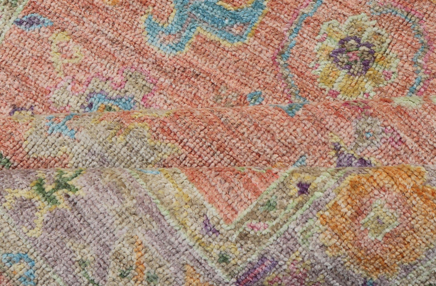 Hand Knotted Turkish Floral Oushak with Orange Background and Lilac Border This very unique piece has a wide array of bright colors, starting with a faded orange background and a light lilac border, showcasing fuchsia, electric blue, violet, or... - Keivan Woven ArtsAN - 149896 - 19941Rug