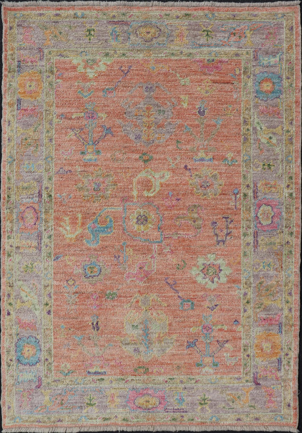 Hand Knotted Turkish Floral Oushak with Orange Background and Lilac Border This very unique piece has a wide array of bright colors, starting with a faded orange background and a light lilac border, showcasing fuchsia, electric blue, violet, or... - Keivan Woven ArtsAN - 149896 - 19941Rug