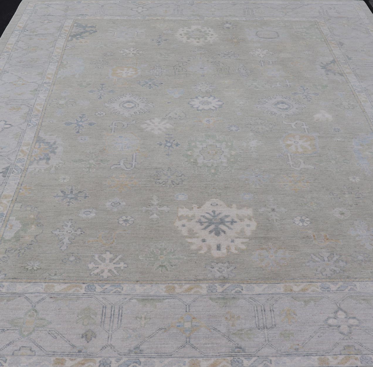 Hand - Knotted Modern Neutral Oushak Rug in Light Gray, Light Blue, Green. Keivan Woven Arts; rug AWR - 16020Country of Origin: Afghanistan Type: Oushak Design: All - Over, Floral Measures: 10.3 x 14.3 This rustic piece holds charm within a powder blu... - Keivan Woven ArtsAWR - 16020 - 24247Rug
