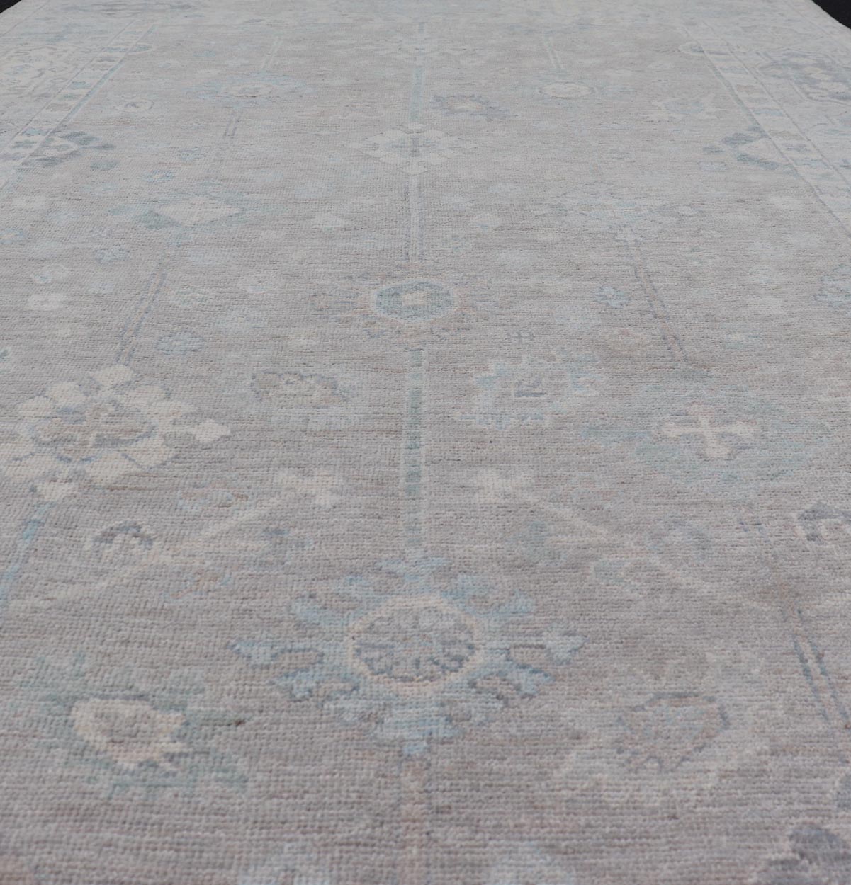 Modern Oushak with Floral Motifs with Cream, Grey, Blue, and Powder Blue. Keivan Woven Arts; rug AWR - 16034 Country of Origin: Afghanistan Type: Oushak Design: Floral, All - Over Abstract - Tribal 21st century. Measures: 6'2 x 10'0 This modern Ousha... - Keivan Woven ArtsAWR - 16034 - 24241Rug