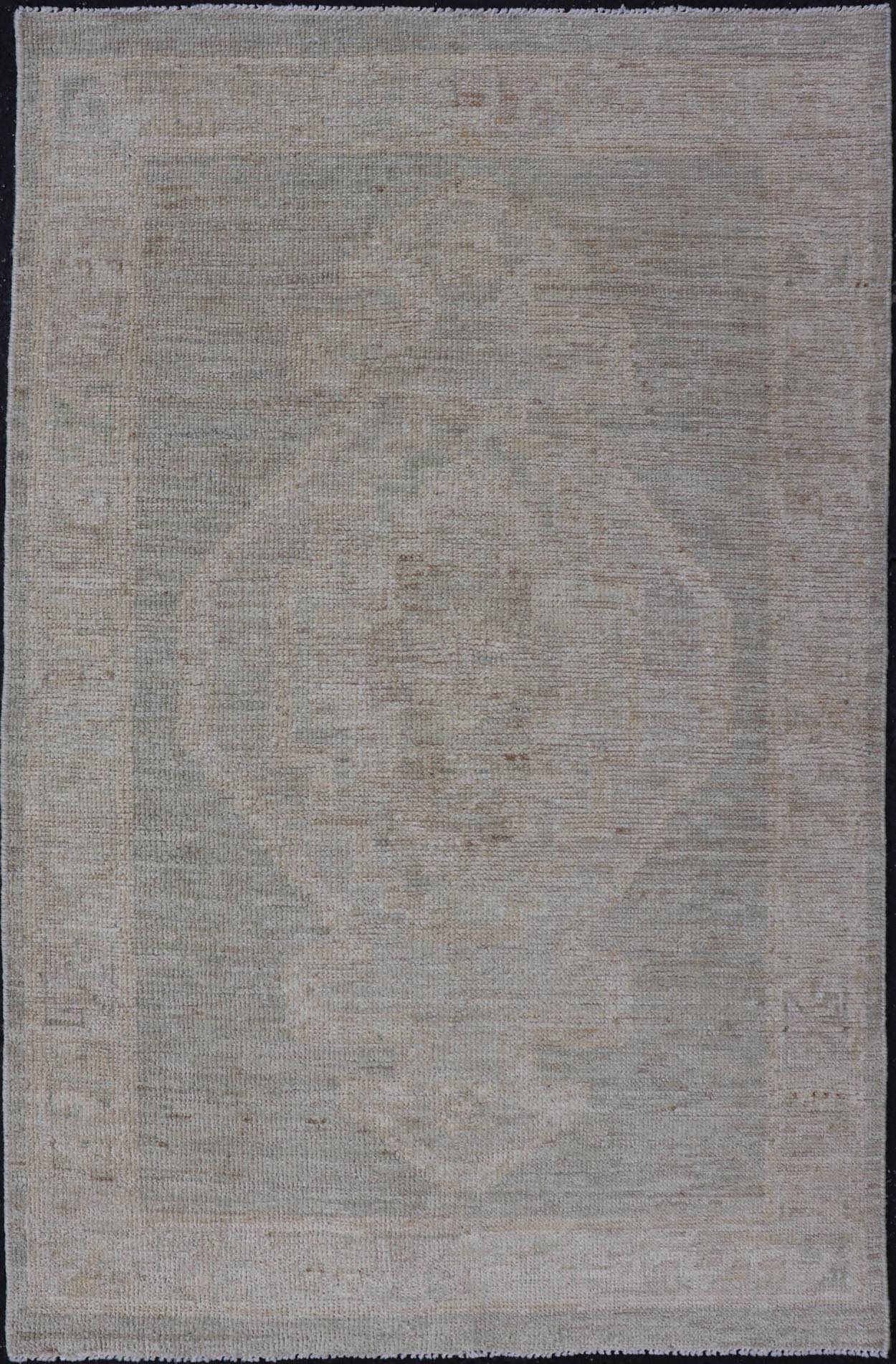 Modern Oushak with Off Gray Background with A Large Tribal Medallion in Cream. Country of Origin: Afghanistan; Type: Oushak; Design: Medallion, Tribal Medallion, All - Over; Keivan Woven Arts: rug AWR - 16772. 21st Century. Measures: 2'8 x 4'3 This... - Keivan Woven ArtsAWR - 16772 - 24444Rug