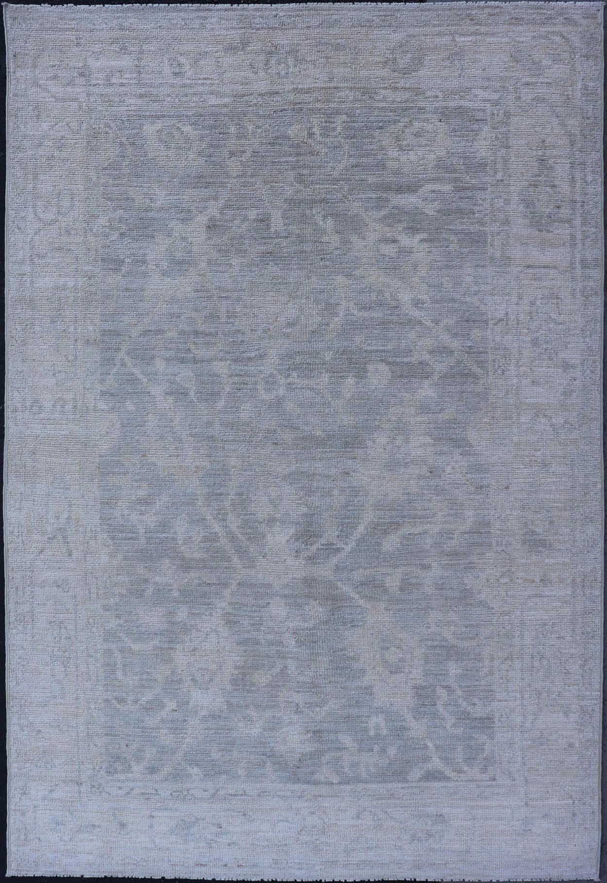 Modern Tribal Oushak with a Cream Border and Light Gray - Green Background. Keivan Woven Arts: rug / AWR - 17770 / Country of Origin: Afghanistan; Type: Oushak; Design: Medallion, Tribal Medallion, All - Over. Measures: 3'10 x 6'0 A Oushak featuring... - Keivan Woven ArtsAWR - 17770 - 25054Rug