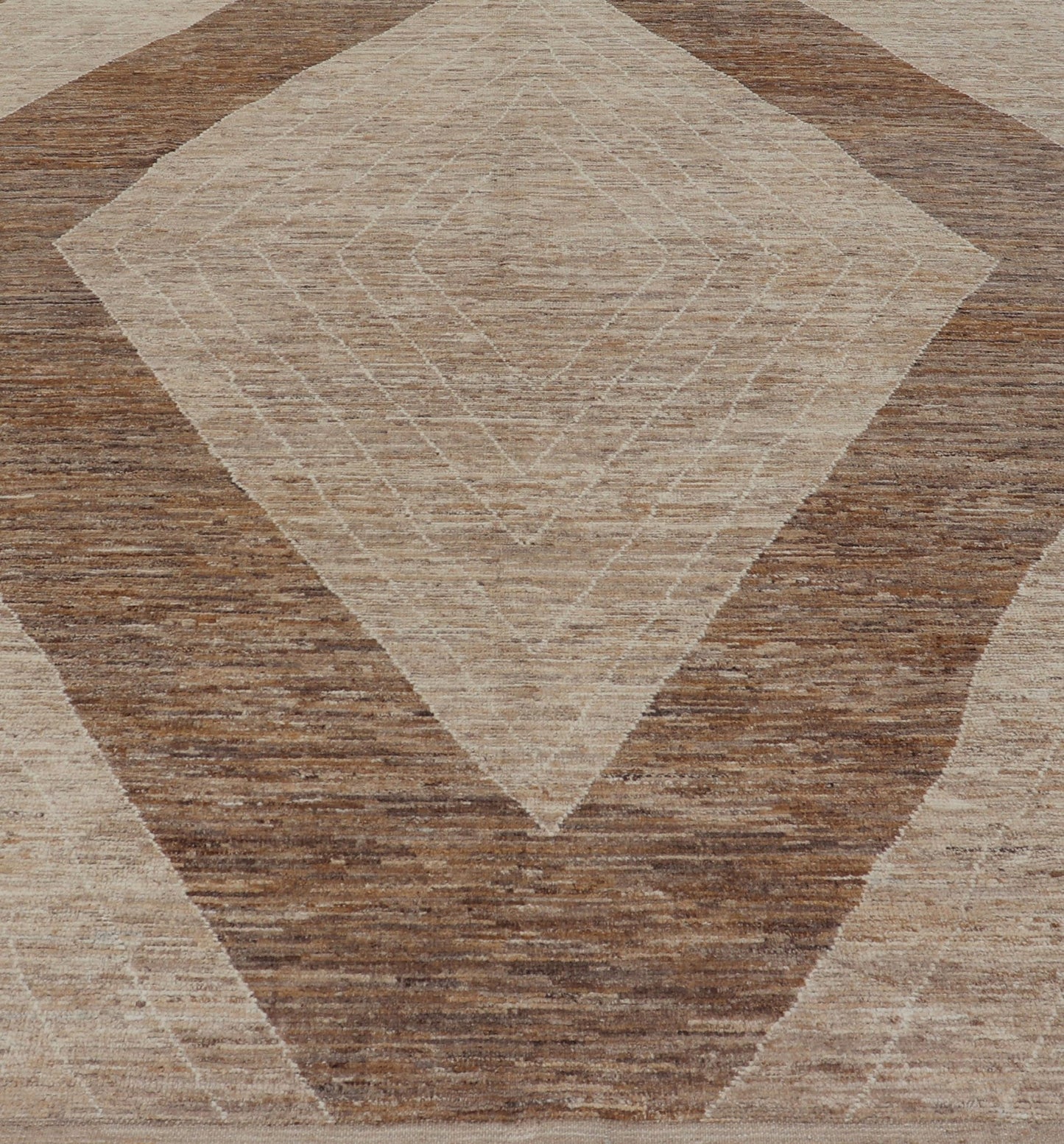Measures: 10'6 x 14'1. This modern casual tribal rug has been hand - knotted in wool. The rug features a large modern diamond design, rendered in brown, tan, and cream; making this rug a superb fit for a variety of interiors. Modern Hand - Knotted Ru... - Keivan Woven ArtsAWR - 5004 - 17148Rug