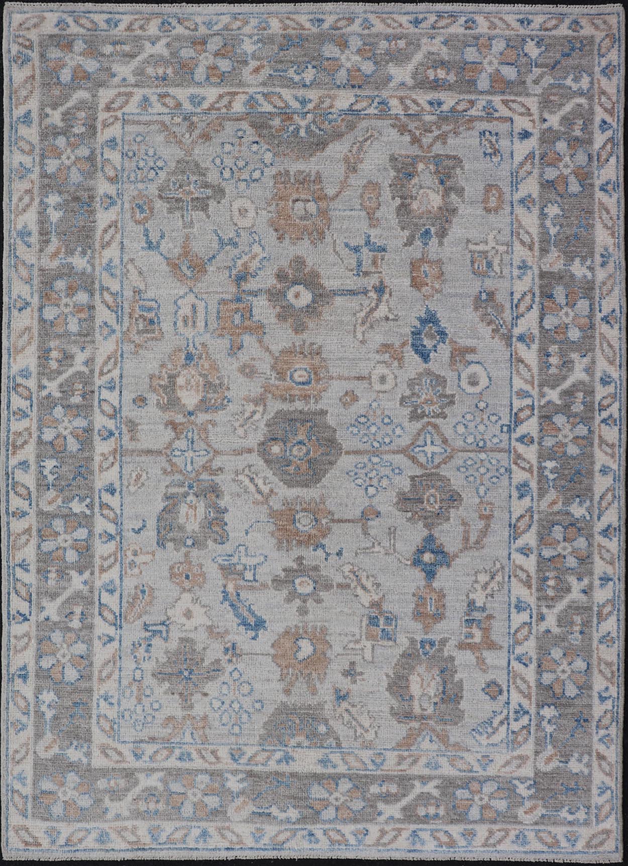 Hand - Knotted All - Over Floral Modern Oushak With Light Brown Border This beautiful contemporary piece starts with a floral border. The field has a modest silvery background with an all - over design rendered with earthy tones, such as wood brown, t... - Keivan Woven ArtsAWR - 6060 - 20001Rug