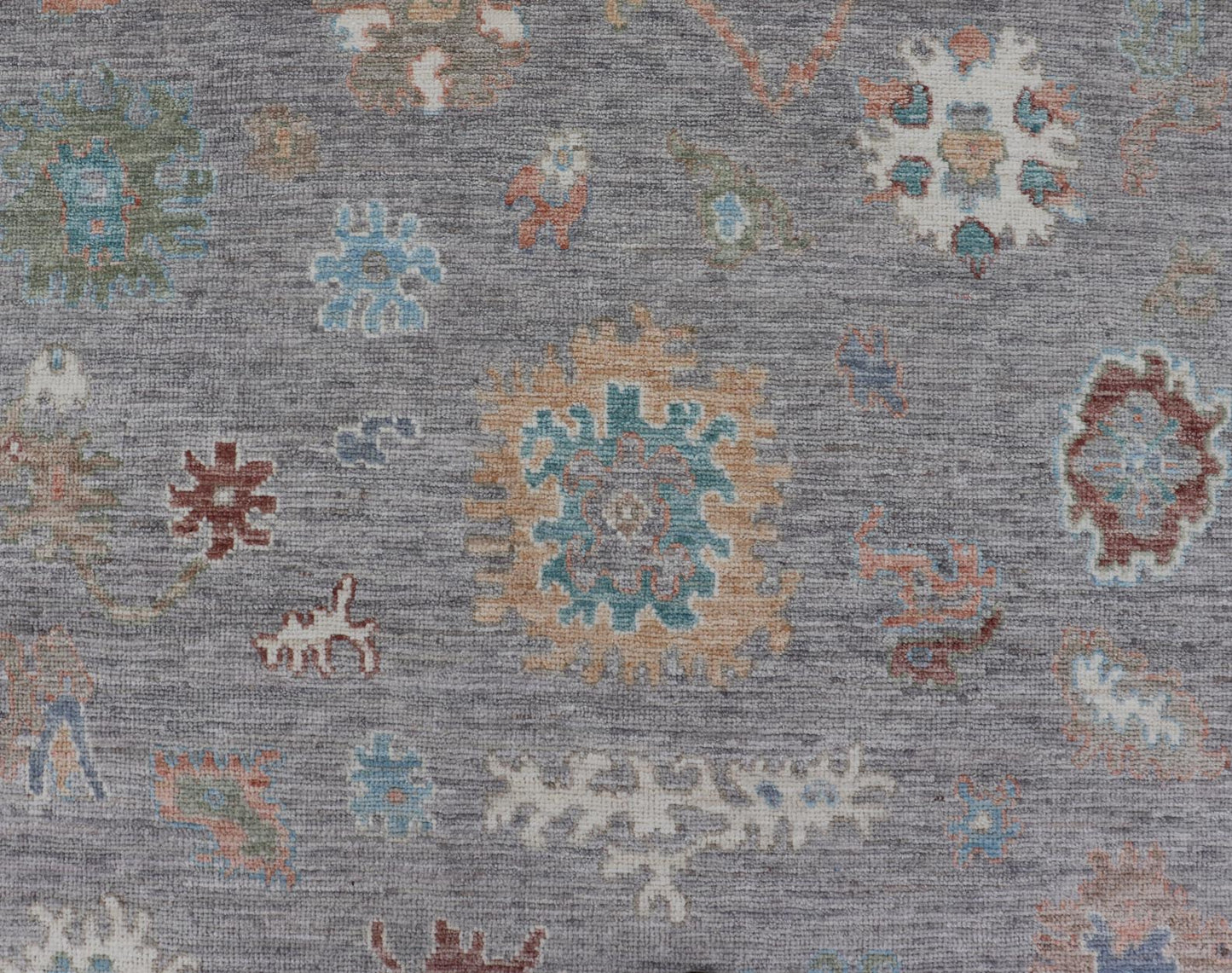 Hand Knotted Floral Oushak With a Gray Background and Multi - Colors This modern casual floral Oushak designed rug has been hand - knotted in wool. The rug features a modern sub - geometric floral design which is enclosed within a complementary, doubl... - Keivan Woven ArtsAWR - 6107 - 20007Rug