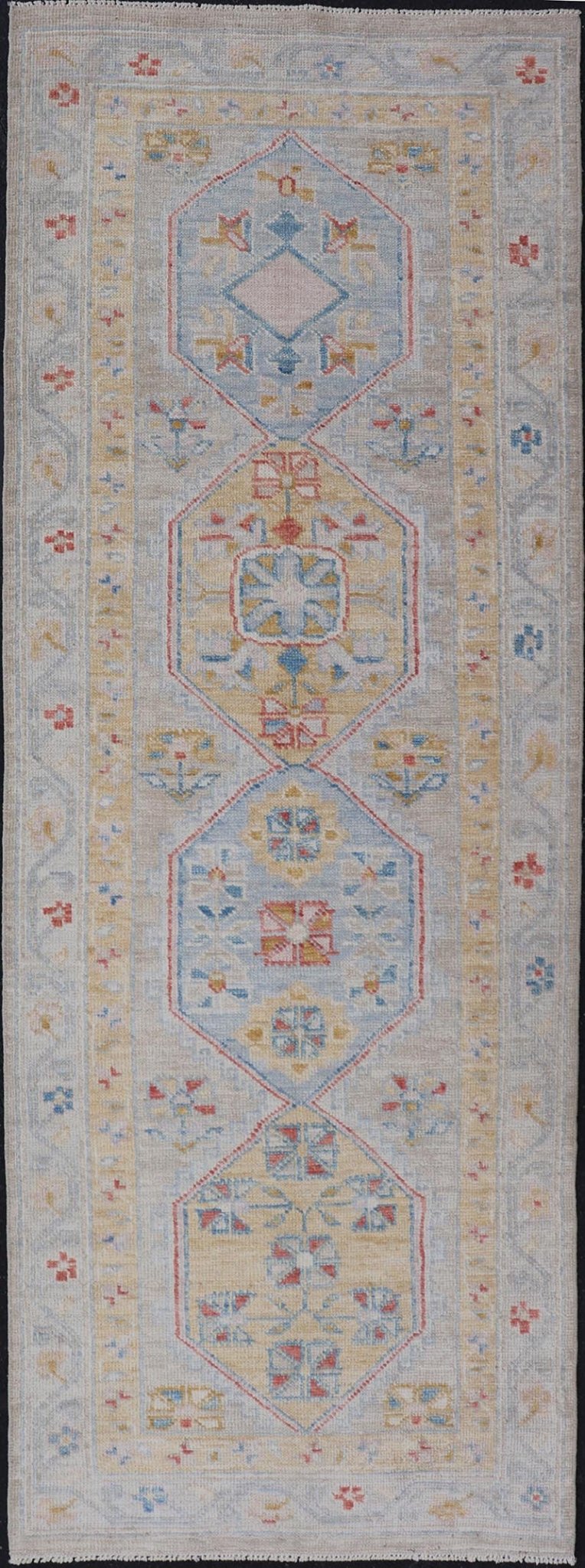 Hand - Knotted Floral Medallion Oushak Runner in Blue and Yellow This piece showcases brilliant medallions encasing star - like motifs in yellow, coral, orange, light blue, and cream. The border displays a yellow band between a cream background.... - Keivan Woven ArtsAWR - 6116 - 20013Rug
