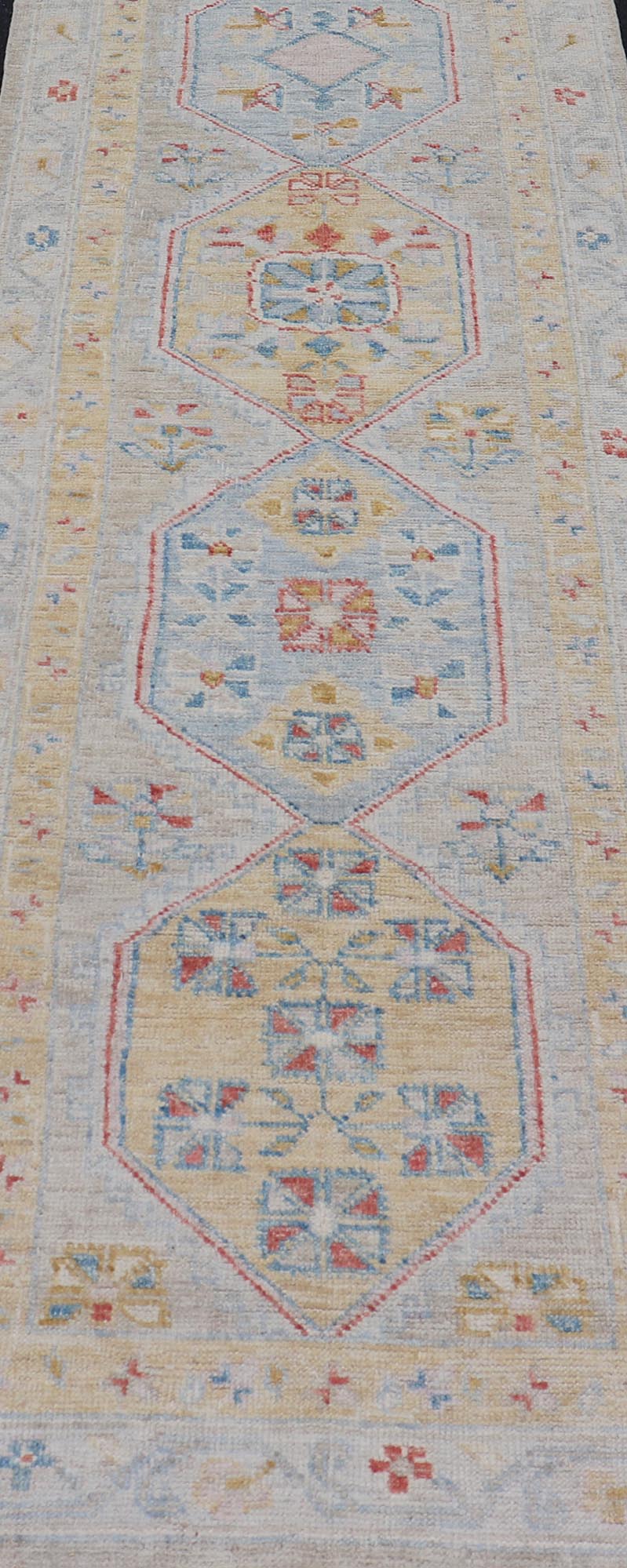 Hand - Knotted Medallion Oushak Design Runner featuring Faded Yellow and Blue's This piece showcases brilliant medallions encasing motifs in buttery yellow, light blue, cream, and shades of blue. The border displays a yellow guard border with a cr... - Keivan Woven ArtsAWR - 6117 - 20019Rug