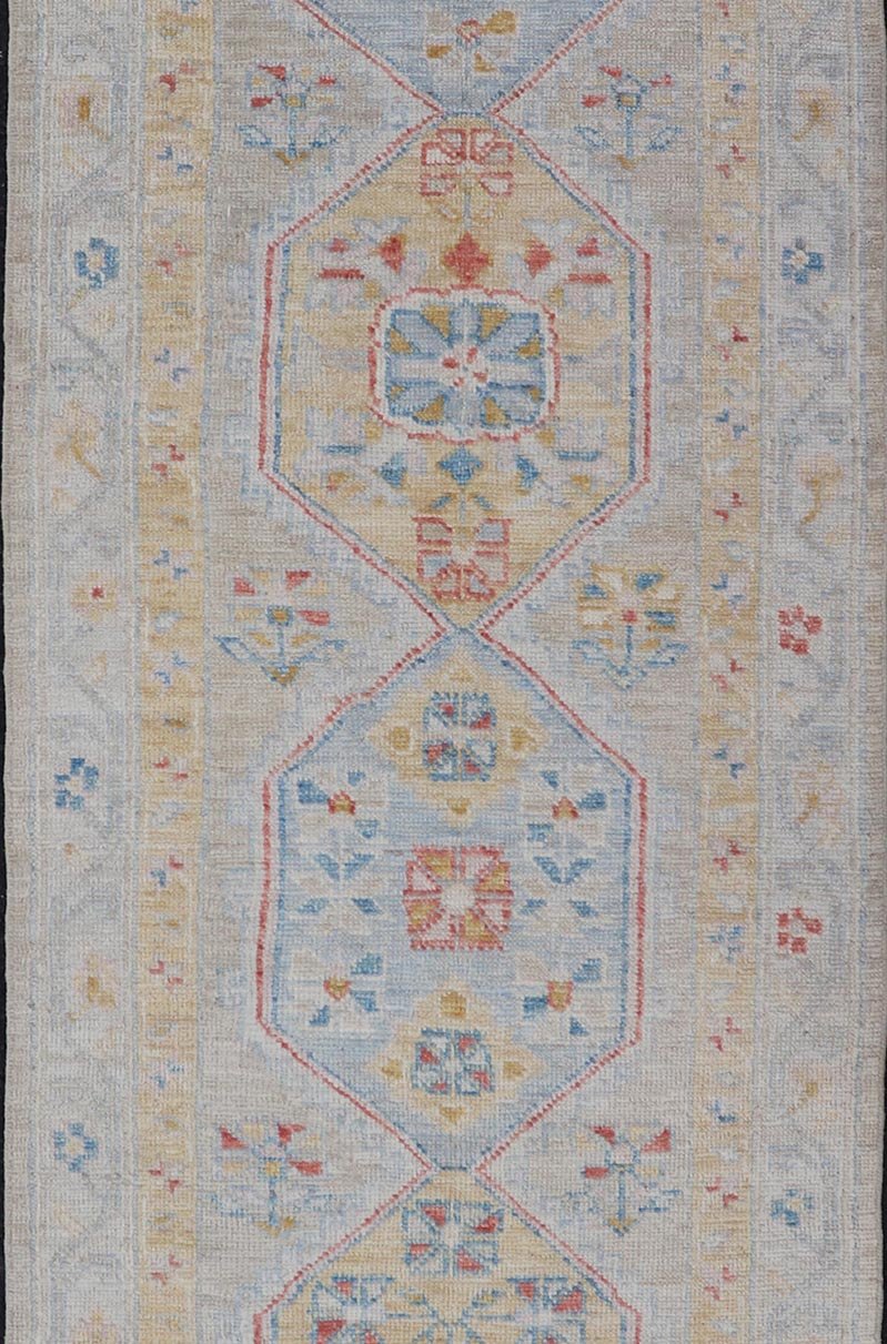 Hand - Knotted Medallion Oushak Design Runner featuring Faded Yellow and Blue's This piece showcases brilliant medallions encasing motifs in buttery yellow, light blue, cream, and shades of blue. The border displays a yellow guard border with a cr... - Keivan Woven ArtsAWR - 6117 - 20019Rug