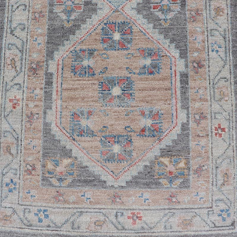 Floral Medallion Oushak Runner With Tribal Motifs and On A Gray Background This Hand - Knotted Afghan Oushak presents a double - lined floral border on top of a dark taupe background, accenting colors such as blue, red, and peach. The field disp... - Keivan Woven ArtsAWR - 6296 - 19905Rug