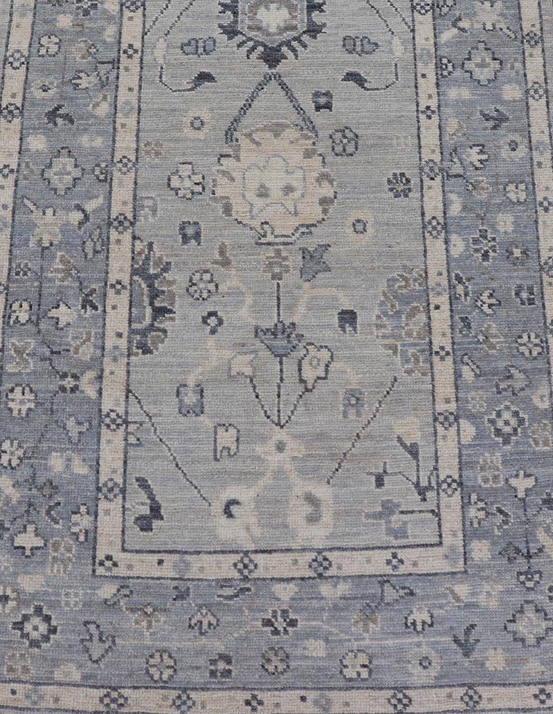 Modern Oushak Design With Light Blue Background and All - Over Design This Afghan runner features a classic Oushak look, showing off brilliant floral motifs and vines reaching all over the field against a cool gray and pewter background. Central ... - Keivan Woven ArtsAWR - 6325 - 20061Rug