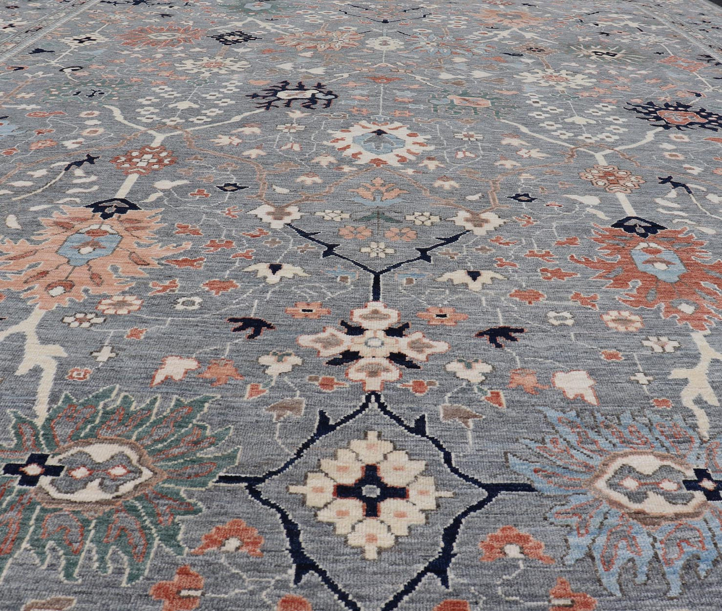 Large Afghan All - Over Designed Oushak with Gray Background and Bright Motifs This large Oushak was hand knotted in Afghanistan. Known for their floral - inspired motifs, this piece has a more modern feel with bright corals, pinks, greens and ... - Keivan Woven ArtsAWR - 6519 - 19917Rug