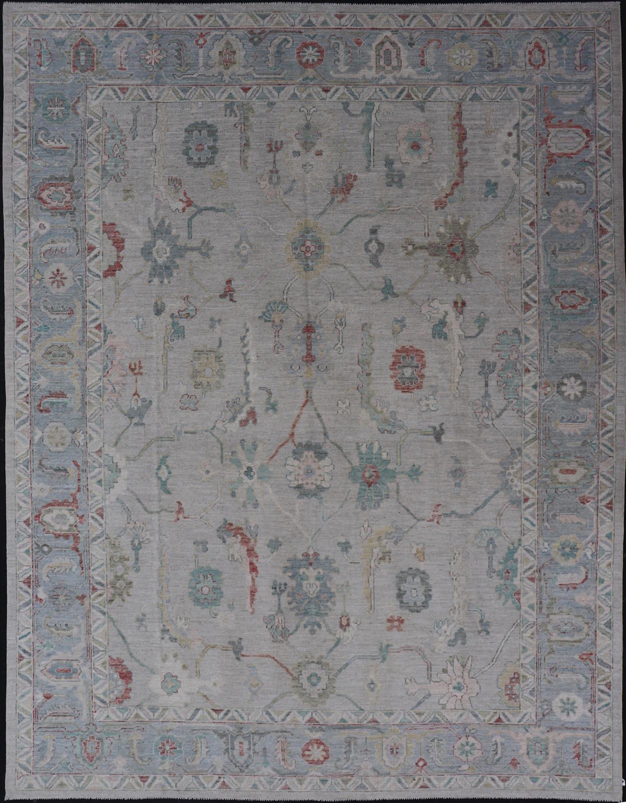 Large Modern Oushak with floral design on light blue/gray border with pops of color. Keivan Woven Arts; rug AWR - 9004 Country of Origin: Afghanistan Type: Oushak Design: Mosaic Floral, All - Over. 21st century. Measures: 10'1 x 13'10. The fi... - Keivan Woven ArtsAWR - 9004 - 21311Rug