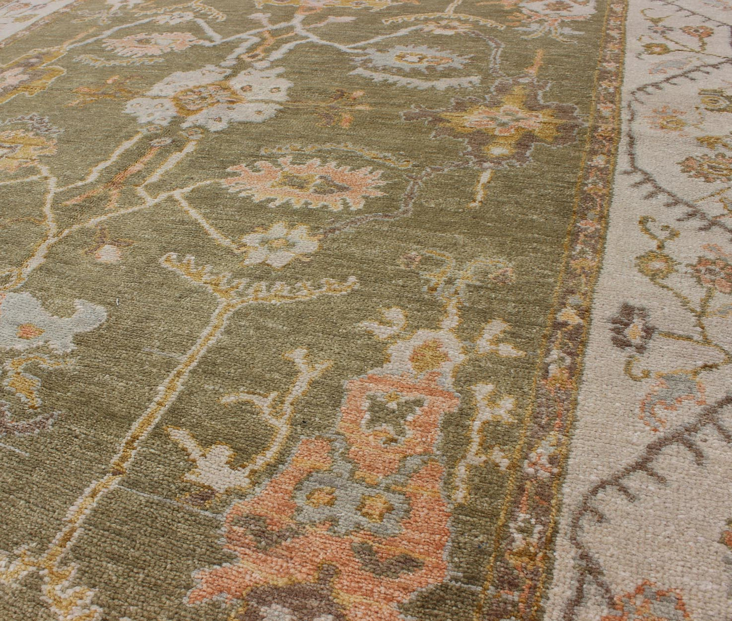 Reproduction Oushak rug with muted tones and neutral color palette and all - over floral design, rug BDH - 712862, country of origin / type: India/ Oushak This New hand knotted Oushak rug features a beautiful design rendered in green tones. Measu... - Keivan Woven ArtsBDH - 712862 - 5950Rug