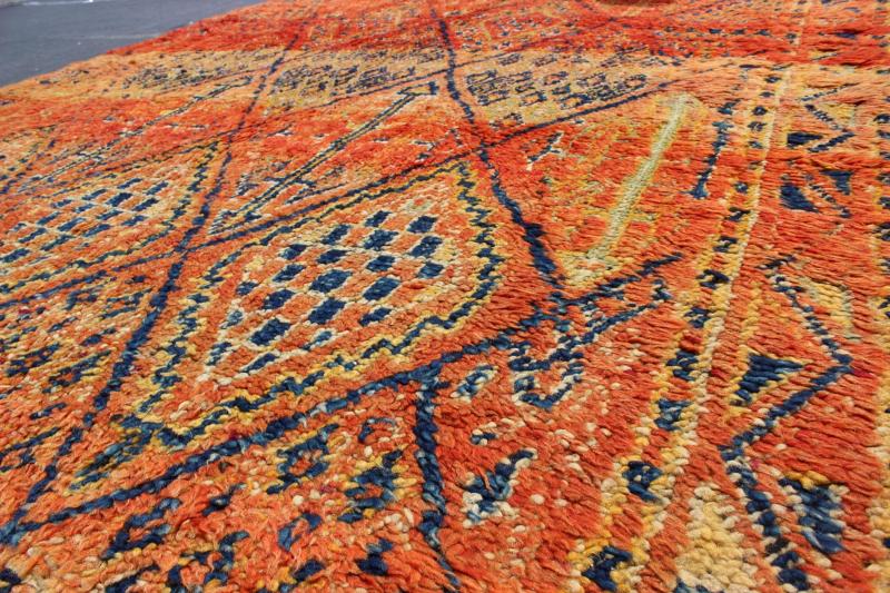 Vintage Moroccan Beni Mklid Rug in Oranges and Creams with Deep Navy Blue Measures: 5'11'' x 10'4''. Woven on a gorgeous luscious black wool base, this original vintage carpet features finely structured diamonds flanked by skillfully woven sy... - Keivan Woven ArtsBDS - 136614 - 7271Rug